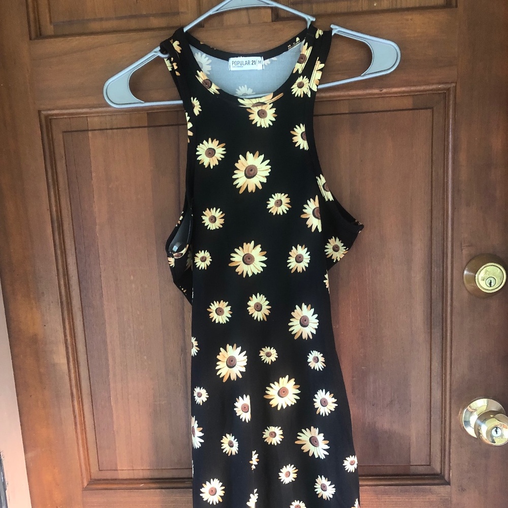 Sleeveless mini dress with a high/halter-style neckline.